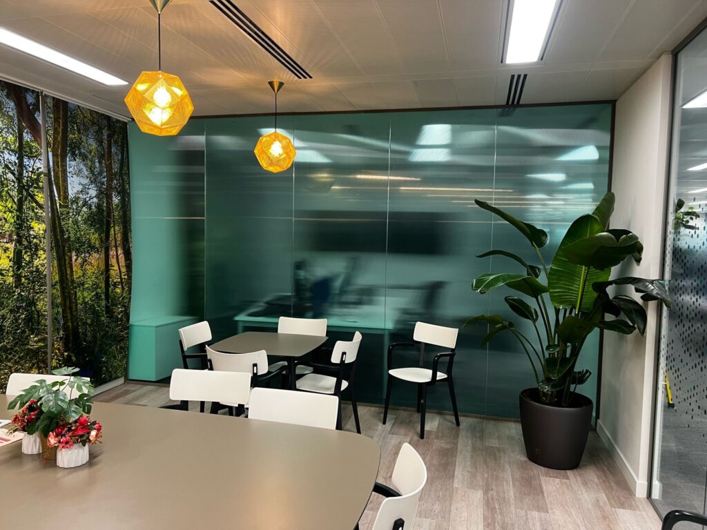 What Signage Solutions Does a Workplace Need to Provide for People to Genuinely Want to Be There? - Signwrite Studios Oaktree Interiors Reeded Film with Printed Optic Clear for corporate colour match