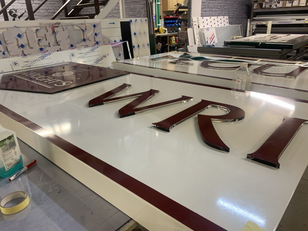 From Rough Idea to Real World Impact: Turning Creative Possibilities Into Signs, Graphics and Branded Spaces - Signwrite Studios Wrights Bakery Enfield - Sign Tray Production