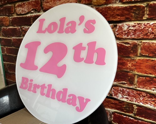 Personalised Acrylic Signs Personalised acrylic sign. Cut in shape of a circle with pink vinyl text