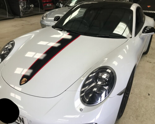 Black and red vinyl bonnet stripes added to a Porsche 911