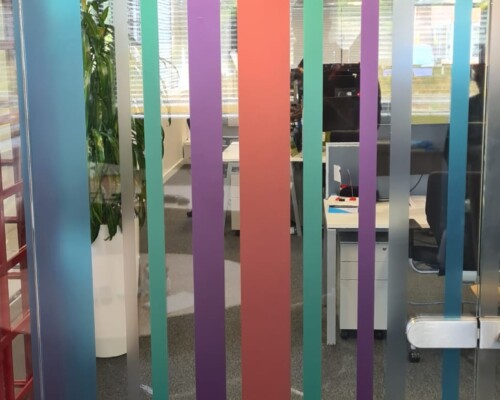 Internal glass partition manifestation - digitally printed & cut as stripes in branded colours