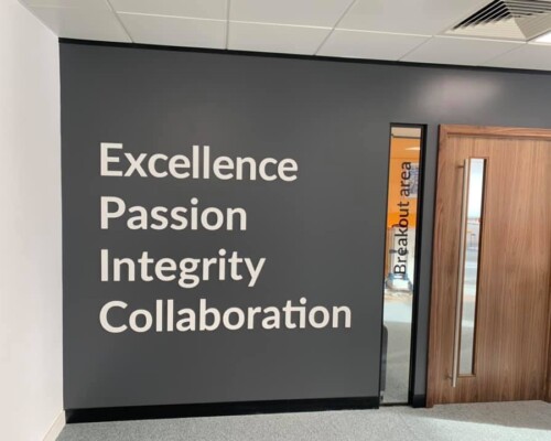 Office Interiors - company vision statements as acrylic flat cut letters White, flat cut acrylic letters "Excellence" "Passion "Integrity" "Collaboration"