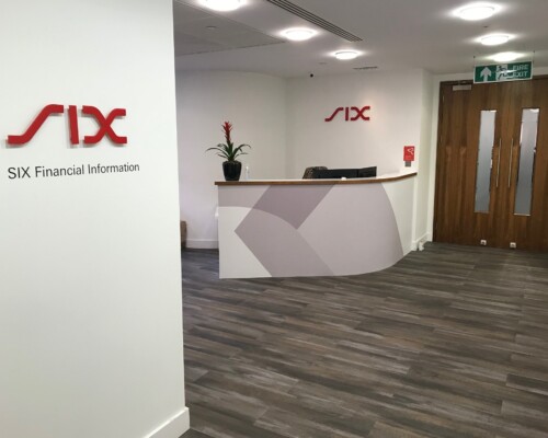 Corporate Office Branding: Acrylic letters & vinyl wall lettering Internal office signs for Six Financial Information. Vinyl wall lettering and acrylic logo cut as individual letters