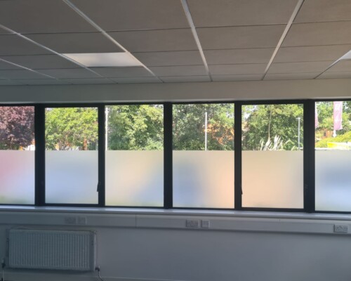 Providing privacy whilst also letting natural light into the office, with lower half of windows wrapped in frosted film.